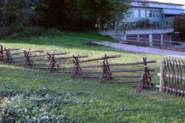 Replicas of old wooden fences in front of the administrative building of the ANL