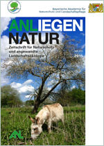 Titelblatt Anliegen Natur 37/1 (Grasender Esel vor einem weiß blühenden Baum)